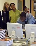 MRSEC Assoc. Director Donna Hammer & U.S. Congresswoman Donna Edwards look on as a Project Lead the Way student shows his work